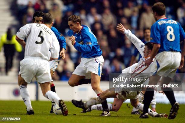 Rangers' Peter Lovenkrands takes on the Motherwell defence