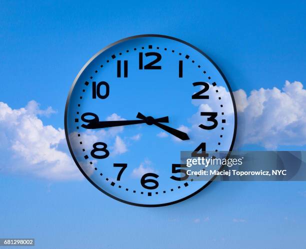 closck superimposed on a blue sky. - temporary hours stock pictures, royalty-free photos & images