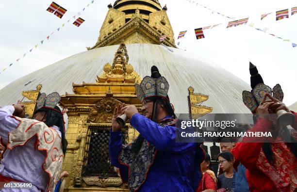 Nepalese Buddhist priests offer prayers during Buddha Purnima, which marks the Buddha's birthday, at Swayambhunath in Kathmandu on May 10, 2017. The...