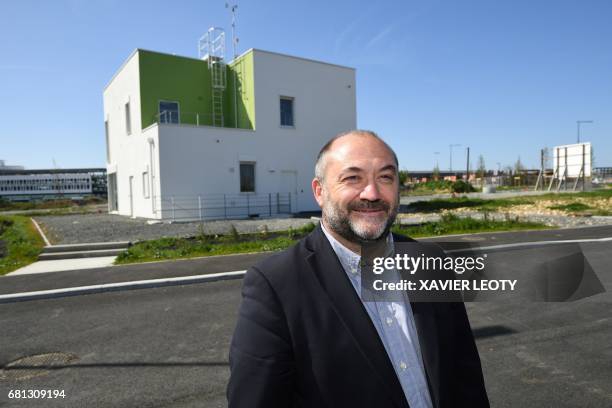 Christophe Philipponneau, director of the Technological and innovative platform for environnemental efficiency poses in front of a bioclimatic house...