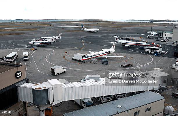 American Eagle planes, which run daily commuter flights to New York, stand parked on the tarmac November 12, 2001 at Logan Airport in Boston MA. All...