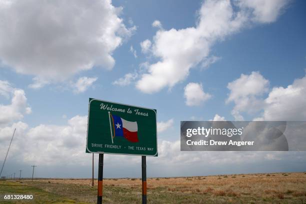 Welcome to Texas' sign stands on the side of the road, May 9, 2017 near Dalhart, Texas. Tuesday was the group's second day in the field for the 2017...