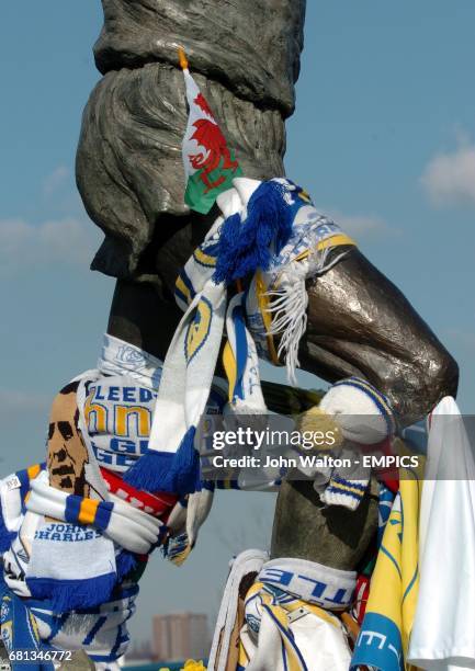 Scarves are tied around the statue of Billy Bremner outside Elland Road on the day of the funeral for ex Leeds United player John Charles