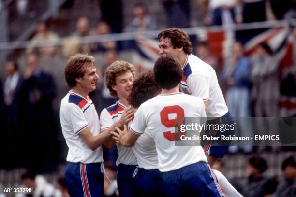 England's Ray Wilkins is congratulated by teammates Phil Thompson, Tony Woodcock, Kevin Keegan, David Johnson and Kenny Sansom after scoring the...