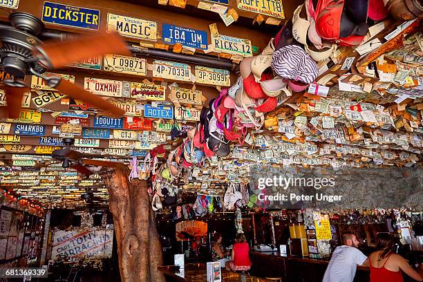 dollar bills stapled at key west bars,florida - florida license plate stock pictures, royalty-free photos & images