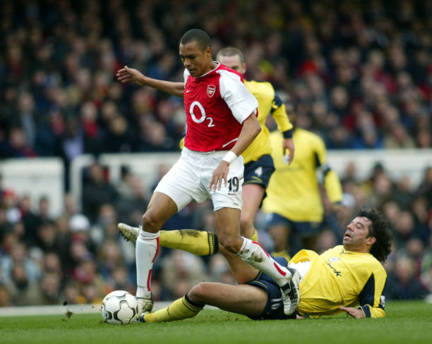 Arsenal's Gilberto Silva is tackled by Bolton Wanderers' Ivan Campo