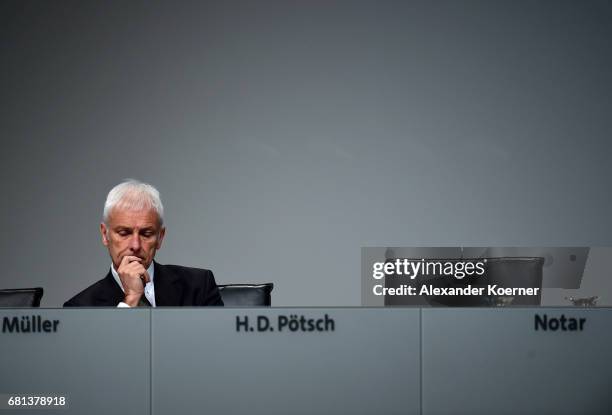 Matthias Mueller, CEO of German carmaker Volkswagen AG, arrives for the company's annual general shareholders meeting on May 10, 2017 in Hanover,...