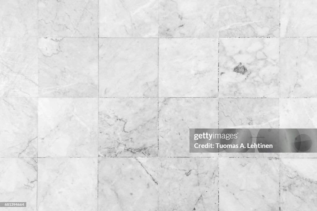 Close-up of a smooth marble floor viewed from above in black&white.