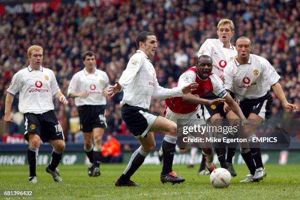 Arsenal's Patrick Vieira is stopped by Manchester United's John O'Shea, Darren Fletcher and Mikael Silvestre