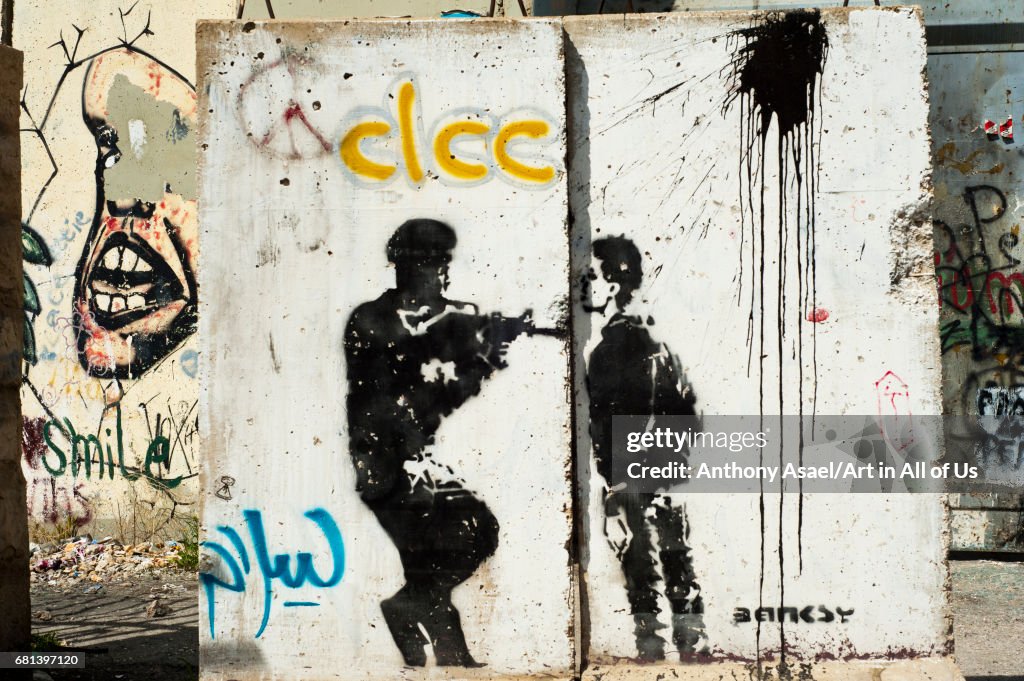 Israeli-built West Bank Wall surrounding Bethlehem with mural art of Banksy, Bethlehem, West Bank, Israel...