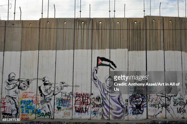 Israeli-built West Bank Wall surrounding Bethlehem with mural art, Bethlehem, West Bank, Israel in March 2017