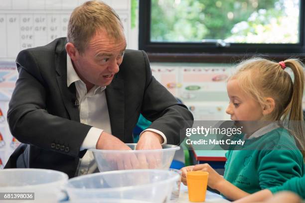 Leader of the Liberal Democrats Tim Farron takes part in a cookery lesson in a classroom as he visits Lewannick Primary School near Launceston on May...