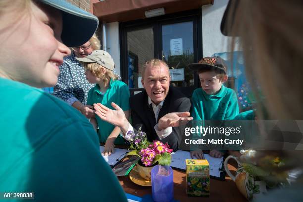 Leader of the Liberal Democrats Tim Farron takes part in a gardening lesson as he visits Lewannick Primary School near Launceston on May 10, 2017 in...