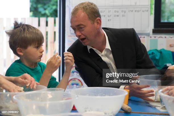 Leader of the Liberal Democrats Tim Farron takes part in a cookery lesson in a classroom as he visits Lewannick Primary School near Launceston on May...