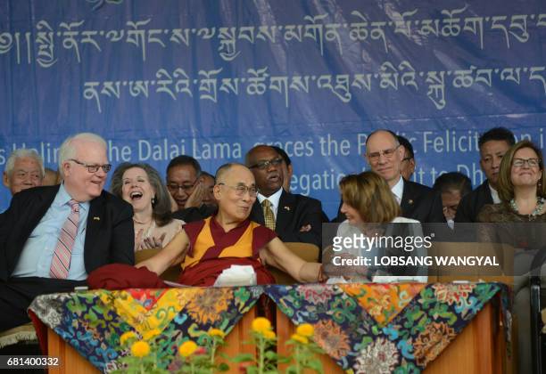 Tibetan Spiritual leader the Dalai Lama and Democratic leader of the US House of Representatives Nancy Pelosi talk onstage during an event addressing...