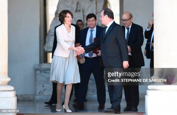 French President Francois Hollande shakes hands with French Minister for Social Affairs and Health Marisol Touraine, at the end of their last weekly...