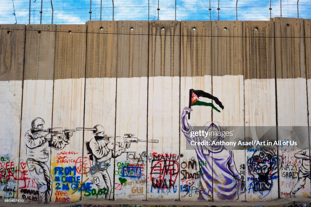 Israeli-built West Bank Wall surrounding Bethlehem with mural art, Bethlehem, West Bank, Israel