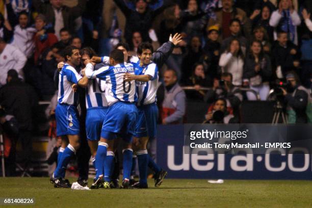 Deportivo La Coruna's players celebrate the fourth goal scored by Fran