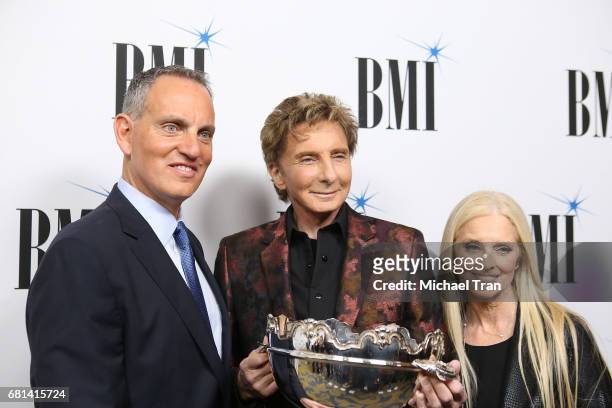 President and CEO Mike O'Neill, singer-songwriter Barry Manilow, and BMI Vice Presdient and General Manager Barbara Cane arrive to the 65th Annual...