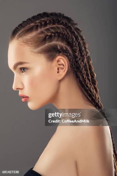 young beautiful woman - braiding plaits stock pictures, royalty-free photos & images