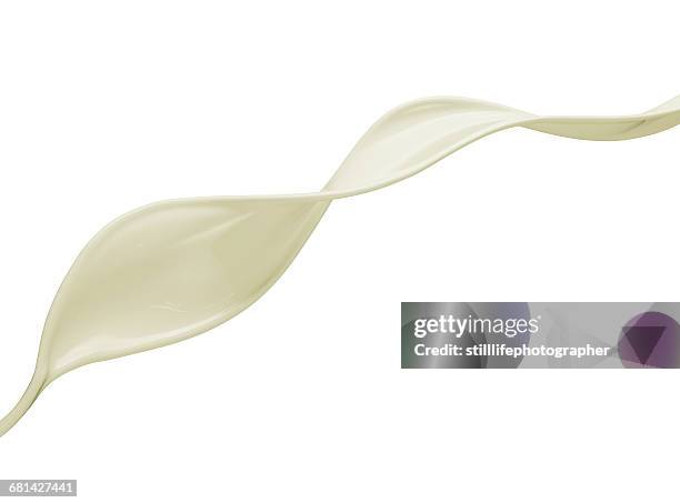 milky lotion splash stream - milk wave stock pictures, royalty-free photos & images