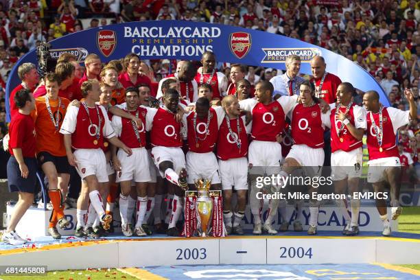 Arsenal players celebrate with the FA Barclaycard Premiership trophy