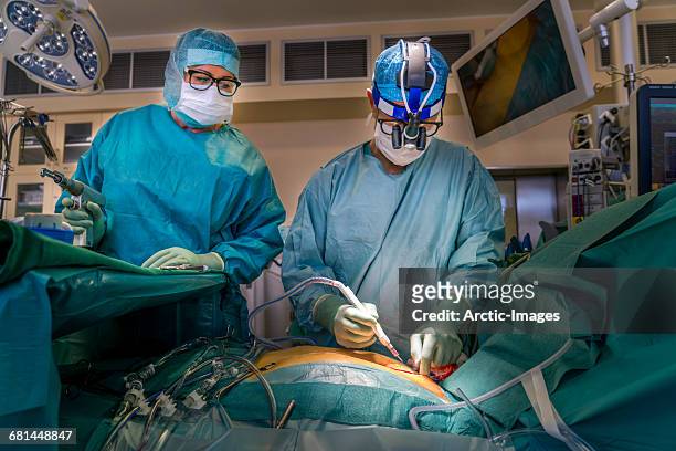 cardiac surgeon and surgical nurse - heart surgery stock pictures, royalty-free photos & images