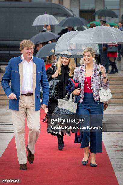 King Willem-Alexander of the Netherlands and Queen Maxima of the Netherlands walk ahead of Princess Mabel of Orange-Nassau attend a lunch on the...
