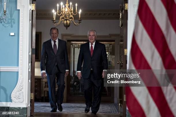 Rex Tillerson, U.S. Secretary of State, right, and Sergei Lavrov, Russia's foreign minister, walk out for photo opportunity at the U.S Department of...