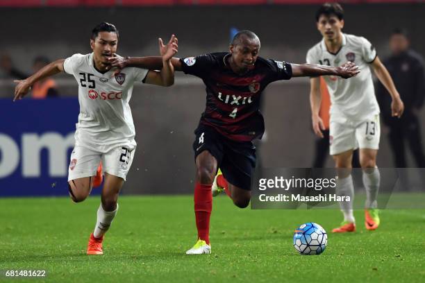 Leo Silva of Kashima Antlers and Adison Promrak of Muangthong United compete for the ball during the AFC Champions League Group E match between...