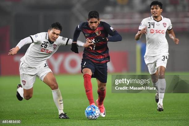 Pedro Junior of Kashima Antlers and Suphan Thongsong of Muangthong United compete for the ball during the AFC Champions League Group E match between...