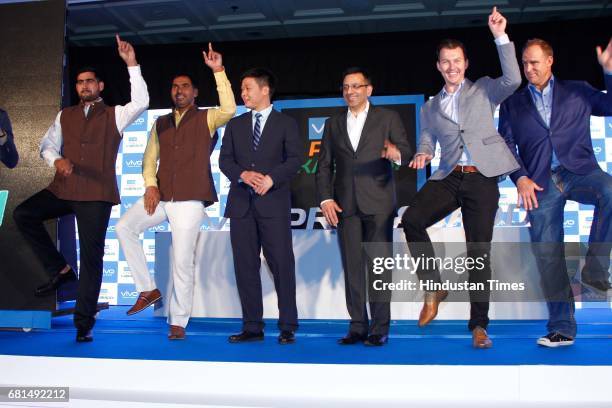 Indian Kabaddi players Rahul Chaudhari, Anup Kumar pose with Kent Cheng, CEO, Vivo India, Sanjay Gupta, Managing Director, Star India, and Former...