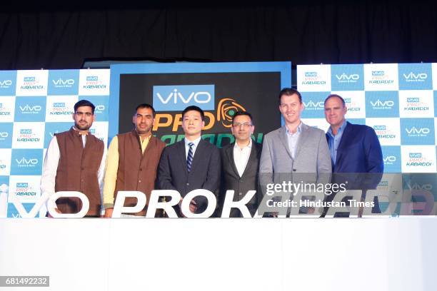 Indian Kabaddi players Rahul Chaudhari, Anup Kumar pose with Kent Cheng, CEO, Vivo India, Sanjay Gupta, Managing Director, Star India, and former...