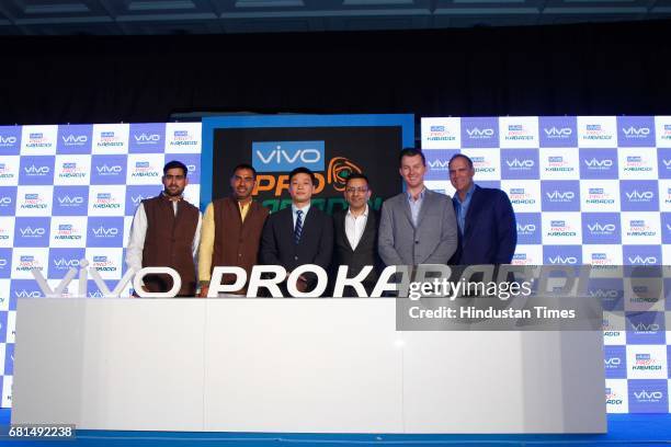 Indian Kabaddi players Rahul Chaudhari, Anup Kumar pose with Kent Cheng, CEO, Vivo India, Sanjay Gupta, Managing Director, Star India and former...