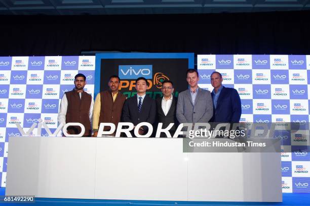 Indian Kabaddi players Rahul Chaudhari, Anup Kumar pose with Kent Cheng, CEO, Vivo India, Sanjay Gupta, Managing Director, Star India and former...