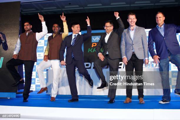 Indian Kabaddi players Rahul Chaudhari, Anup Kumar pose with Kent Cheng, CEO, Vivo India, Sanjay Gupta, Managing Director, Star India and former...