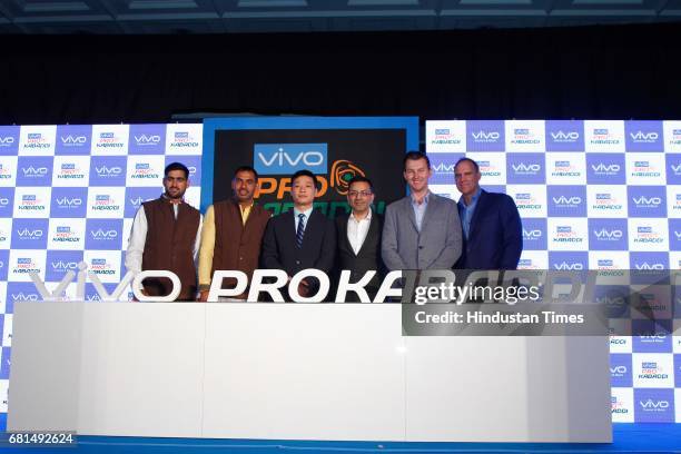 Indian Kabaddi players Rahul Chaudhari, Anup Kumar pose with Kent Cheng, CEO, Vivo India, Sanjay Gupta, Managing Director, Star India and former...