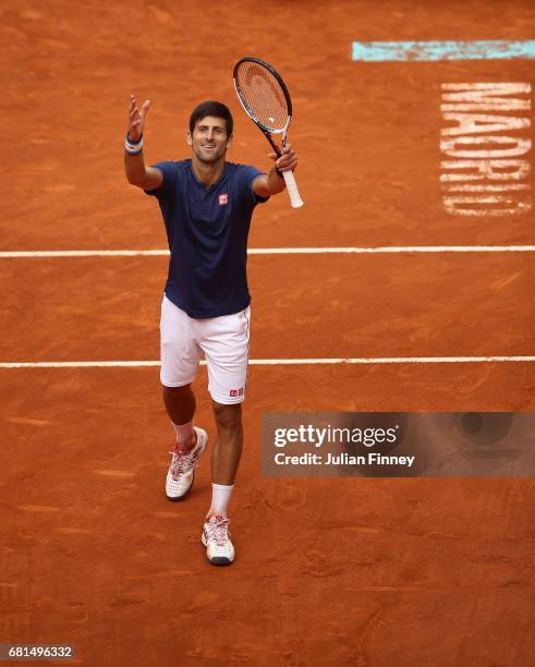 Novak Djokovic of Serbia celebrates defeating Nicolas Almagro of Spain during day five of the Mutua Madrid Open tennis at La Caja Magica on May 10,...