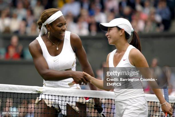 Serena Williams shakes hands with Jie Zheng at the end of the match which she won