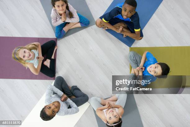 yoga circle - black kids yoga stock pictures, royalty-free photos & images