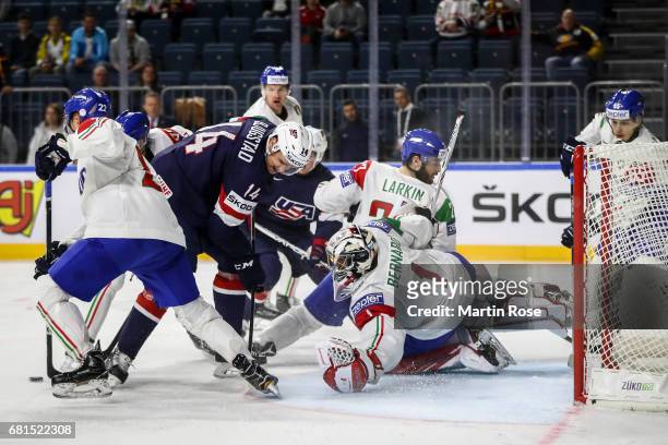 Nick Bjugstad is challenged by Andreas Bernard goalkeeper of Italy during the 2017 IIHF Ice Hockey World Championship game between USA and Italy at...