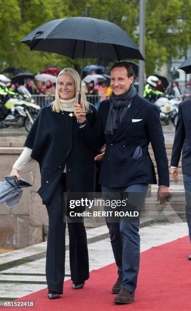 Crown Prince Haakon of Norway and Crown Princess Mette-Marit of Norway arrive at Honnorbrygga in Oslo from where they will start for a lunch trip on...