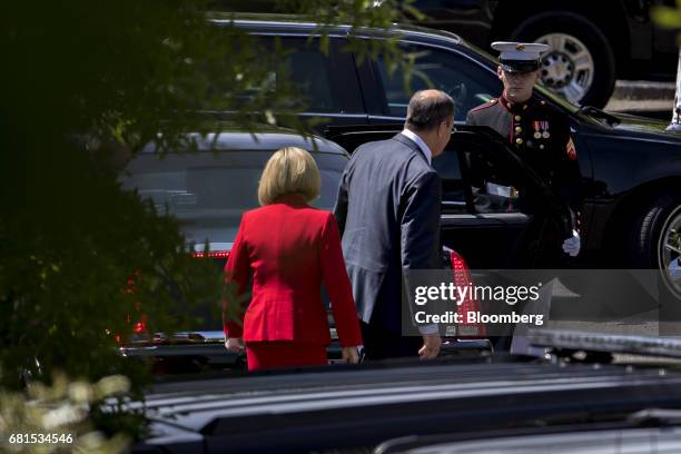 Sergei Lavrov, Russia's foreign minister, center, leaves after a meeting U.S. President Donald Trump, not pictured, near the West Wing of the White...