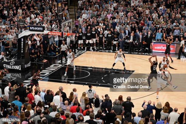 Manu Ginobili of the San Antonio Spurs blocks the shot of James Harden of the Houston Rockets in Game Five of the Western Conference Semifinals...