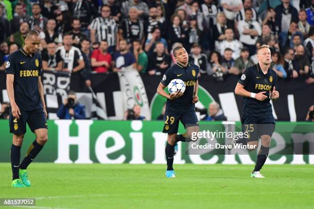 Kylian Mbappe of Monaco runs back to the centre circle after pulling back a goal during the Uefa Champions League match, semi final second leg,...