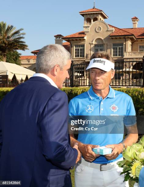 Tour Commissioner Jay Monahan speaks with Bernhard Langer of Germany during The Constellation Senior Players Media Blitz with Bernhard Langer during...