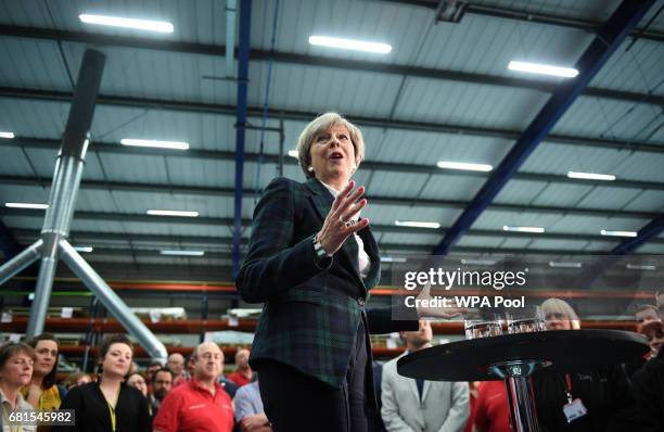 Prime Minister Theresa May speaks to an assembled crowd during a general election campaign event at marketing services group Linney on May 10, 2017...