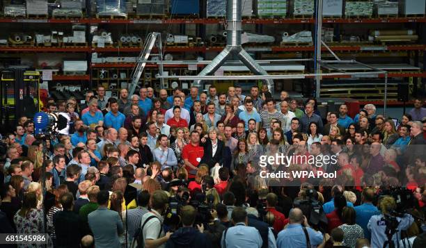 Prime Minister Theresa May points as she speaks to an assembled crowd during a general election campaign event at marketing services group Linney on...