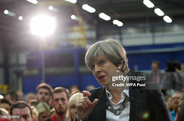 Prime Minister Theresa May speaks to an assembled crowd during a general election campaign event at marketing services group Linney on May 10, 2017...