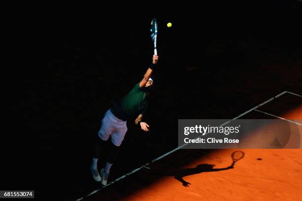 Fabio Fognini of Italy serves during his match against Rafael Nadal of Spain on day five of the Mutua Madrid Open tennis at La Caja Magica on May 10,...